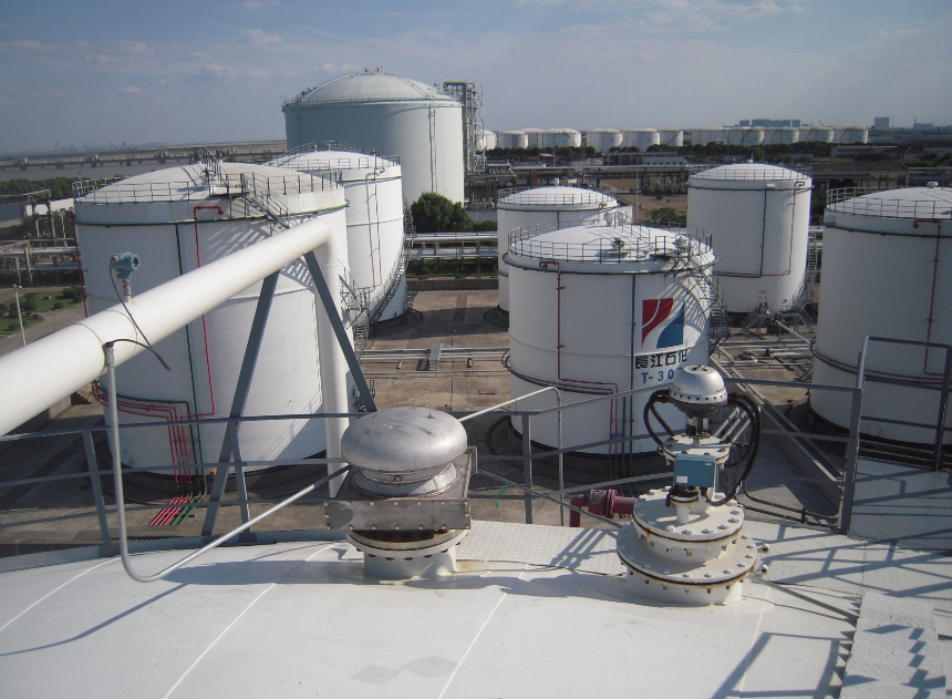 Oil tank farm vapor recovery area with storage tanks and vapor piping