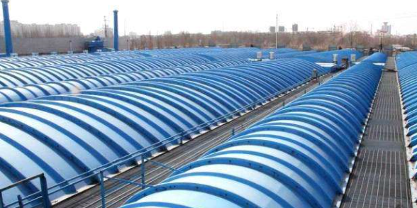 Blue FRP domes covering aeration basins at a wastewater treatment plant